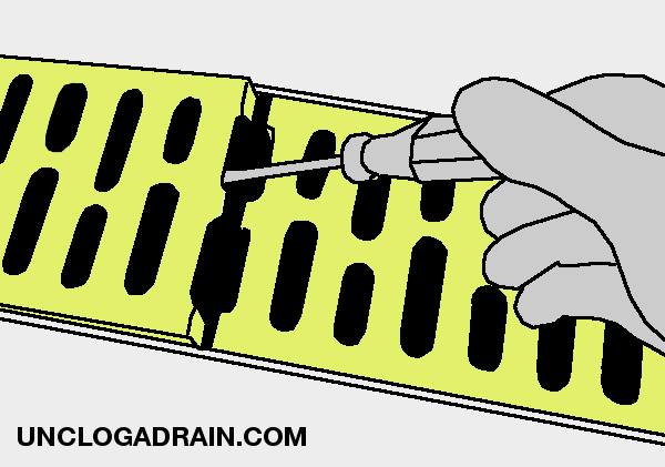 Remove the garage floor trench drain grates